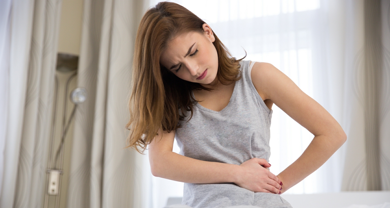 woman suffering with irritable bowel syndrome